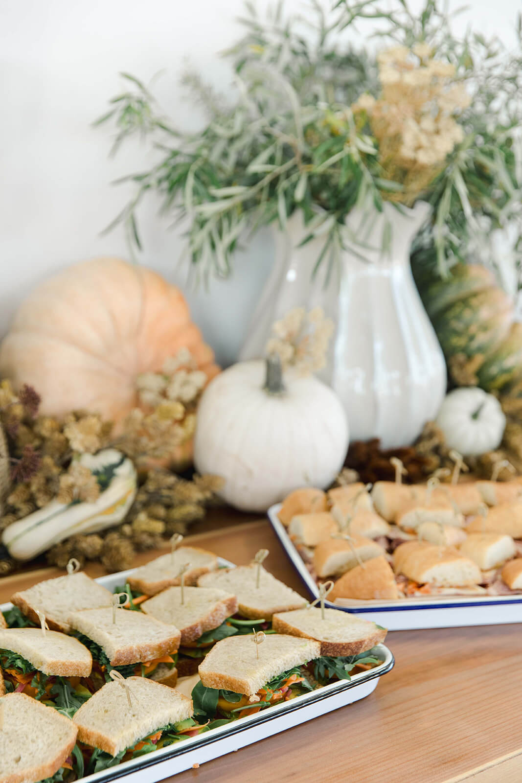 a serving tray with sandwiches